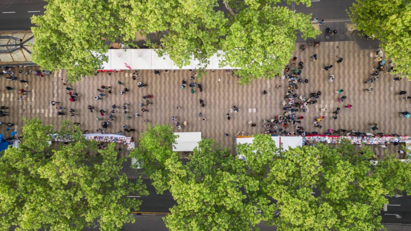 VAerial view of the Sant Jordi stands installed on la Rambla with people walking