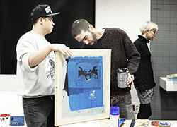 Group of young people participating in a painting workshop 