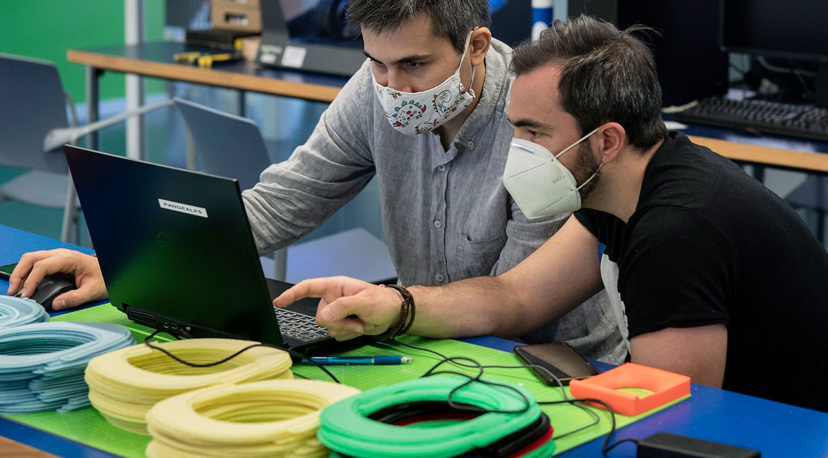 Two people working on a computer