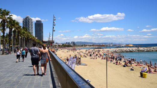 Walking On The Promenade Of Barceloneta Beach Barcelona