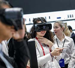 MWC conference attendees with virtual reality glasses