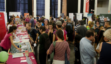 Exhibitors and visitors from a trade fair with social economic projects